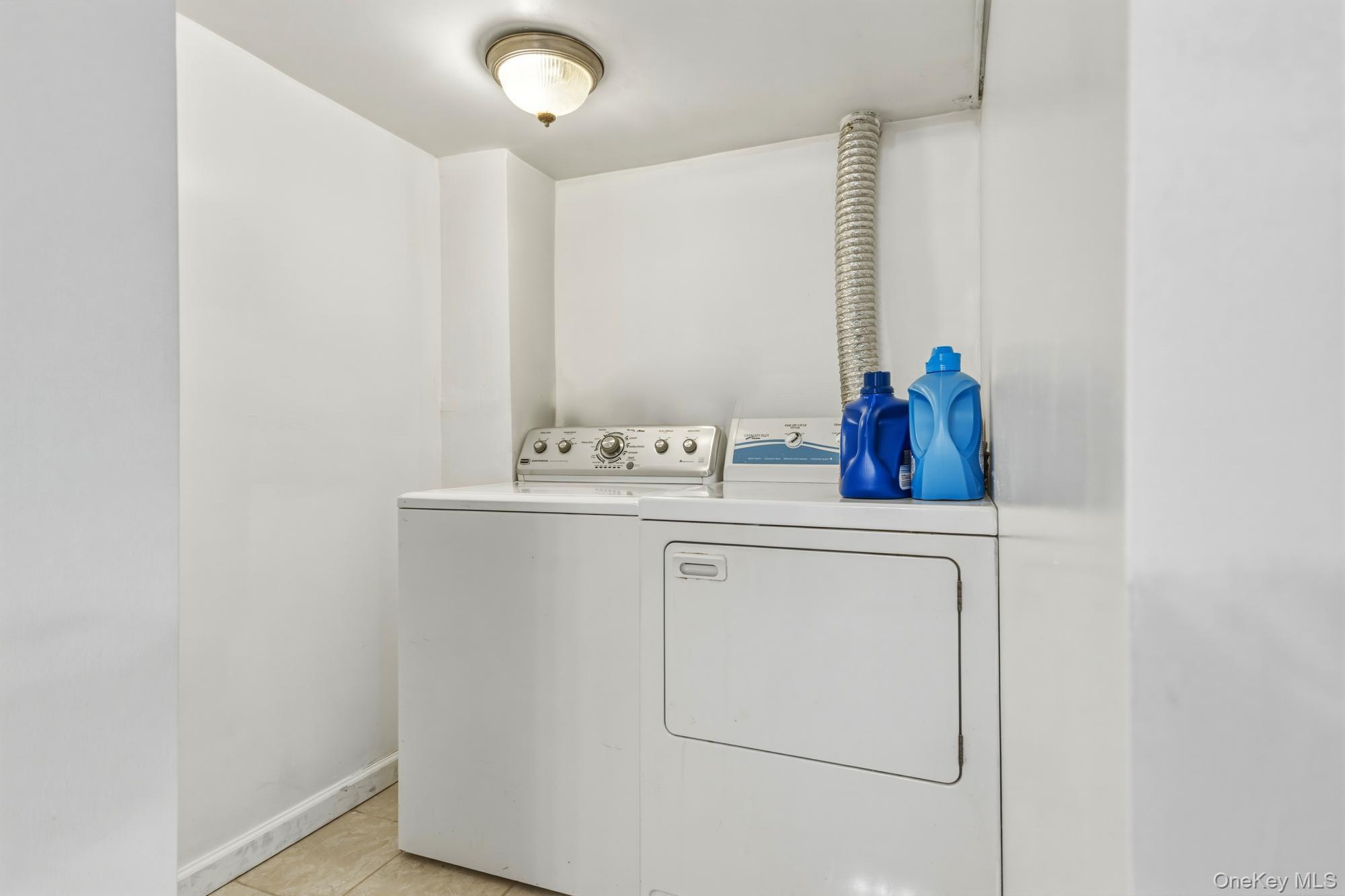 188-11 Dormans Road Queens, NY 11412 - Photo 17 of 32 a utility room with dryer and washer