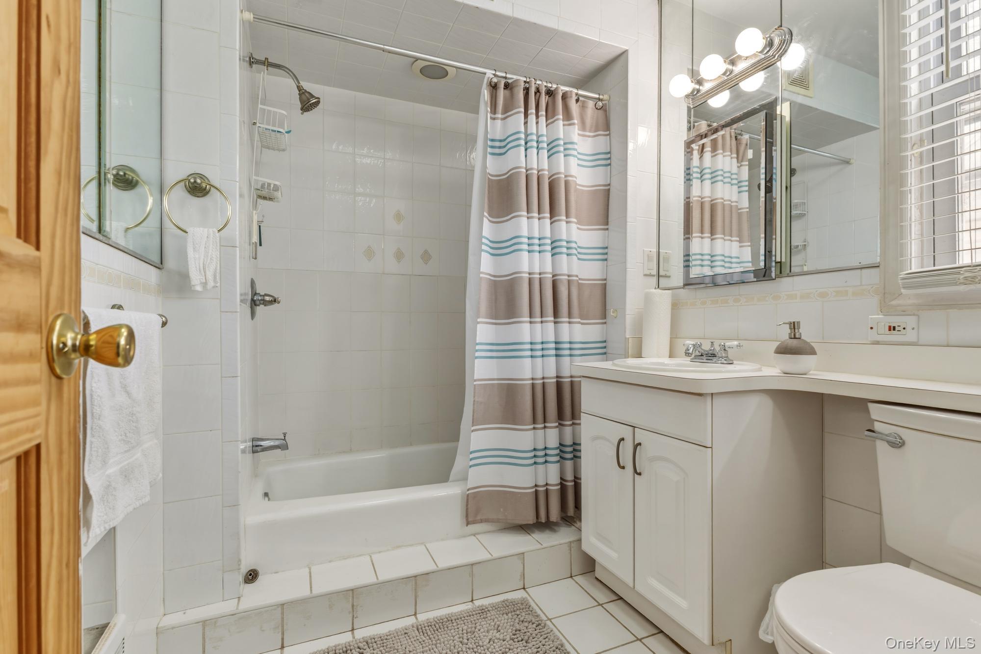 188-11 Dormans Road Queens, NY 11412 - Photo 21 of 32 a bathroom with a sink toilet and shower