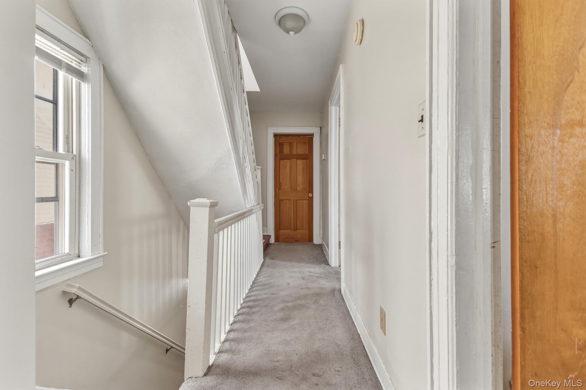 188-11 Dormans Road Queens, NY 11412 - Photo 23 of 32 a view of a hallway with windows