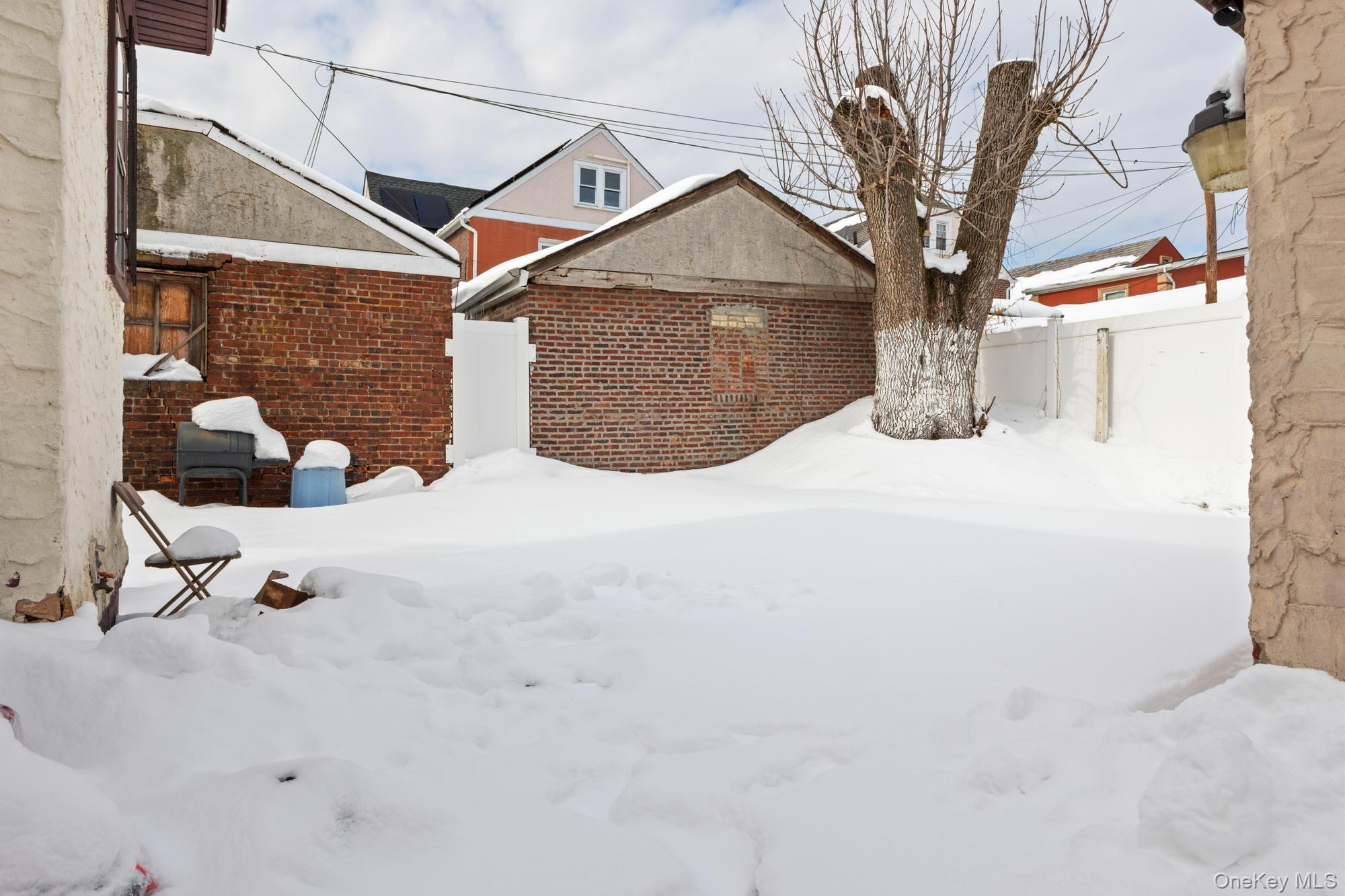 188-11 Dormans Road Queens, NY 11412 - Photo 27 of 32 a view of a house with a snow on the road