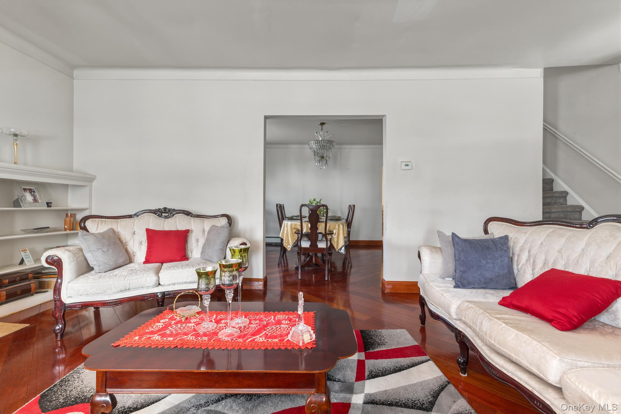 188-11 Dormans Road Queens, NY 11412 - Photo 4 of 32 a living room with furniture and a table