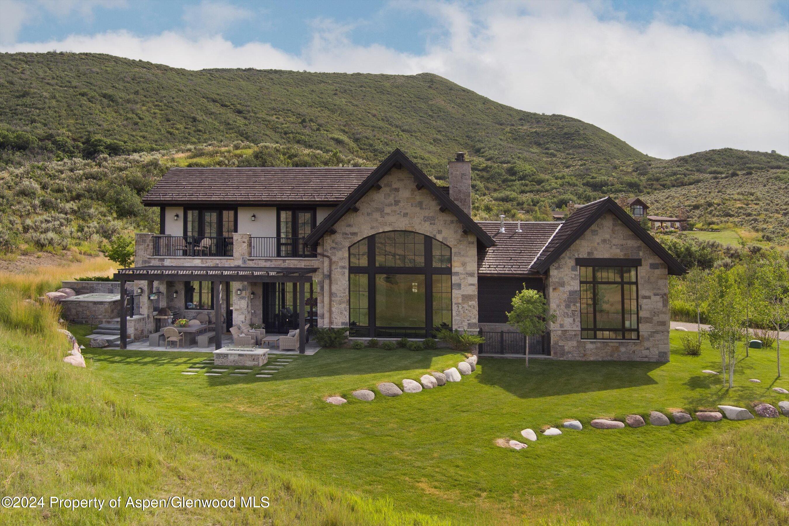 2388 Lazy O Road Snowmass, CO 81654 - Photo 45 of 65 an aerial view of a house with swimming pool in front of it