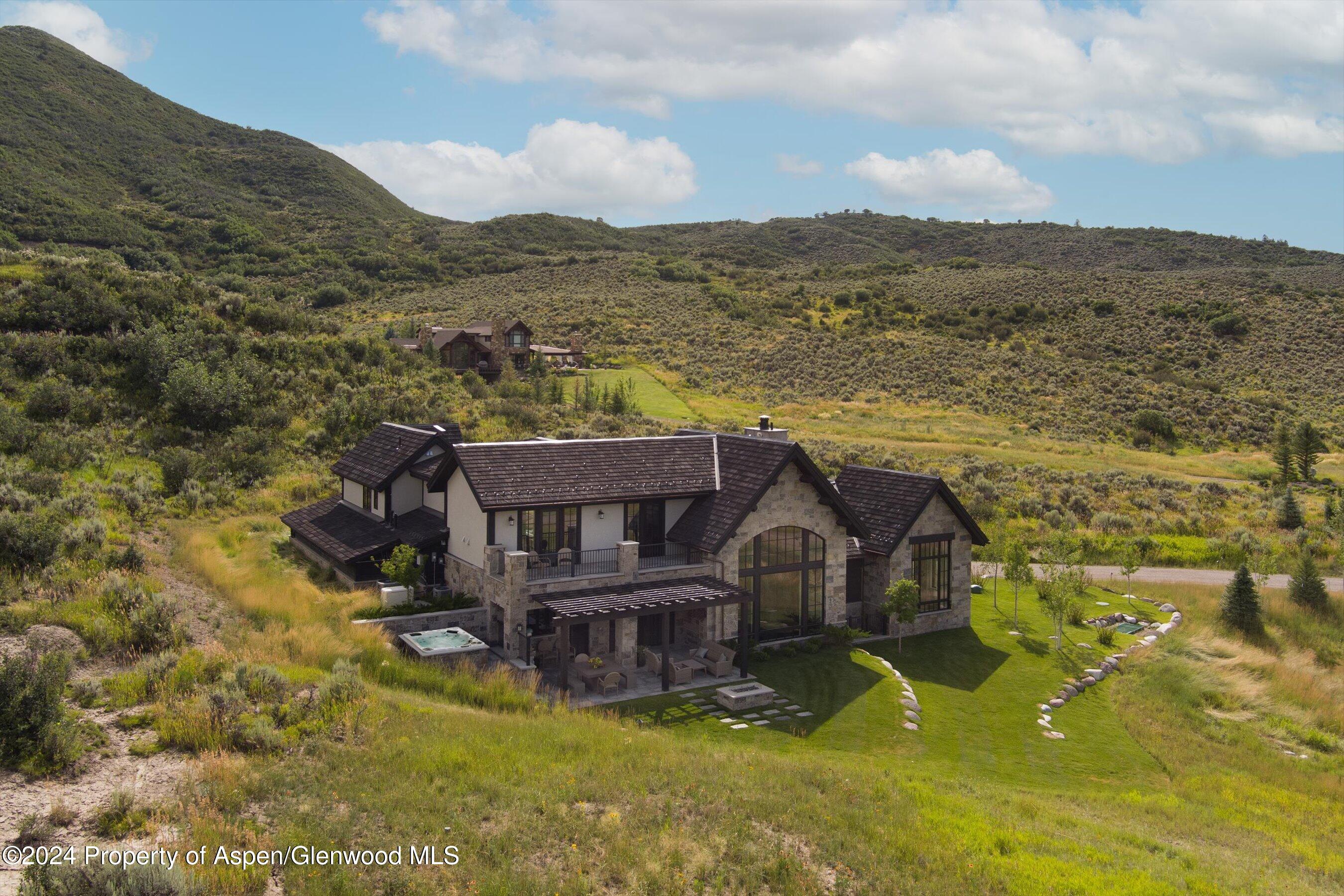 2388 Lazy O Road Snowmass, CO 81654 - Photo 48 of 65 an aerial view of a house with a garden