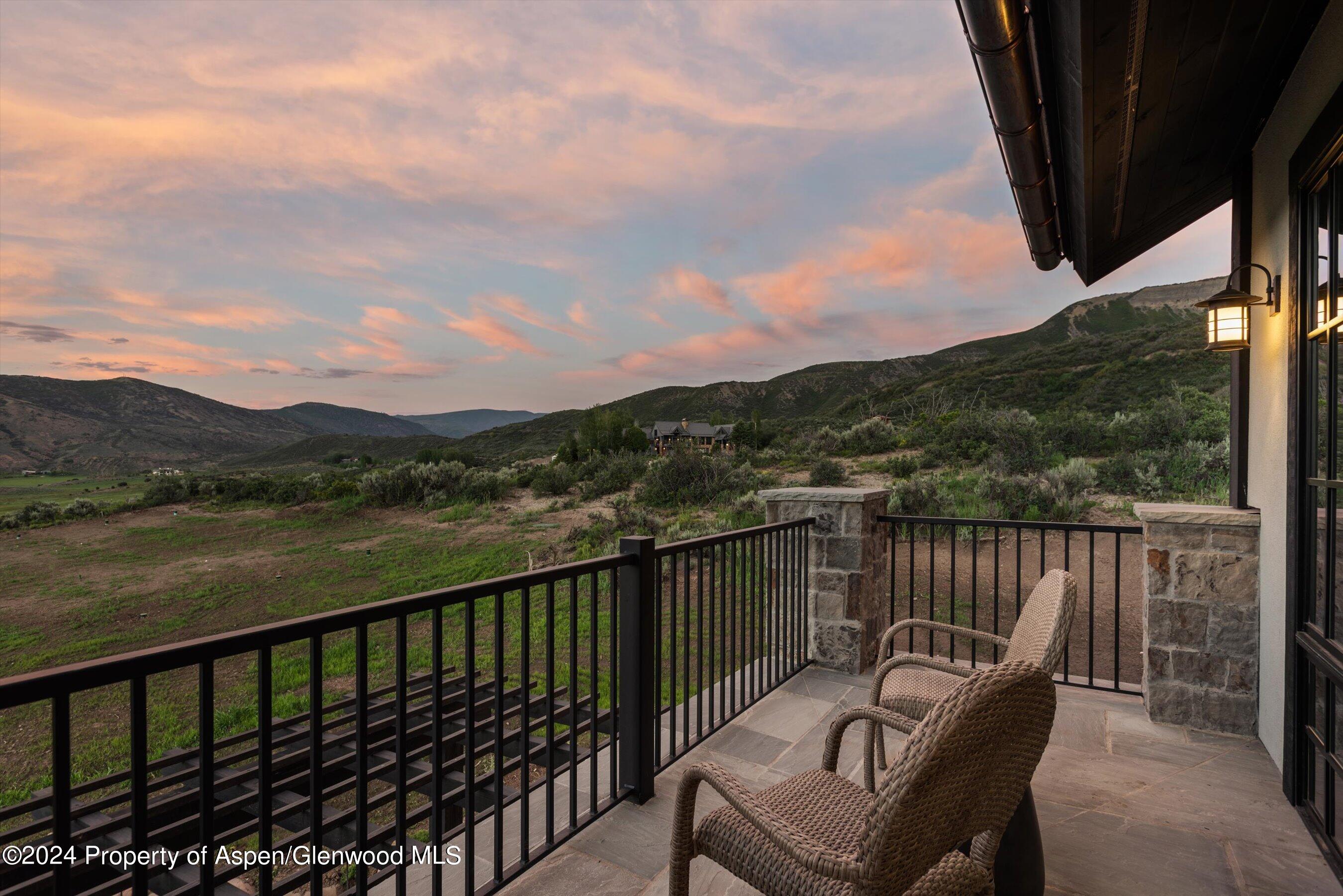 2388 Lazy O Road Snowmass, CO 81654 - Photo 50 of 65 a balcony with wooden floor and lake view