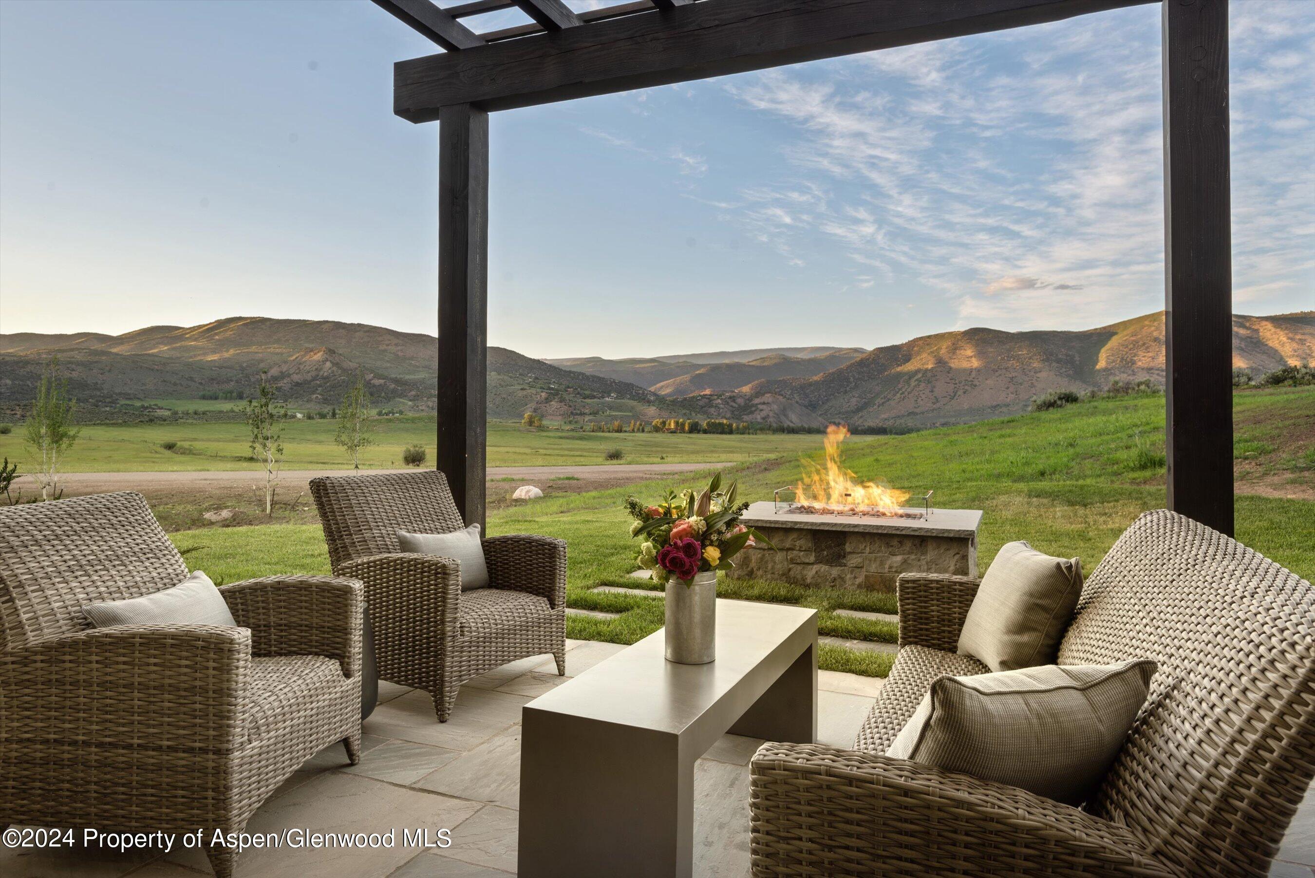 2388 Lazy O Road Snowmass, CO 81654 - Photo 5 of 65 a view of a patio with couches chairs and a table