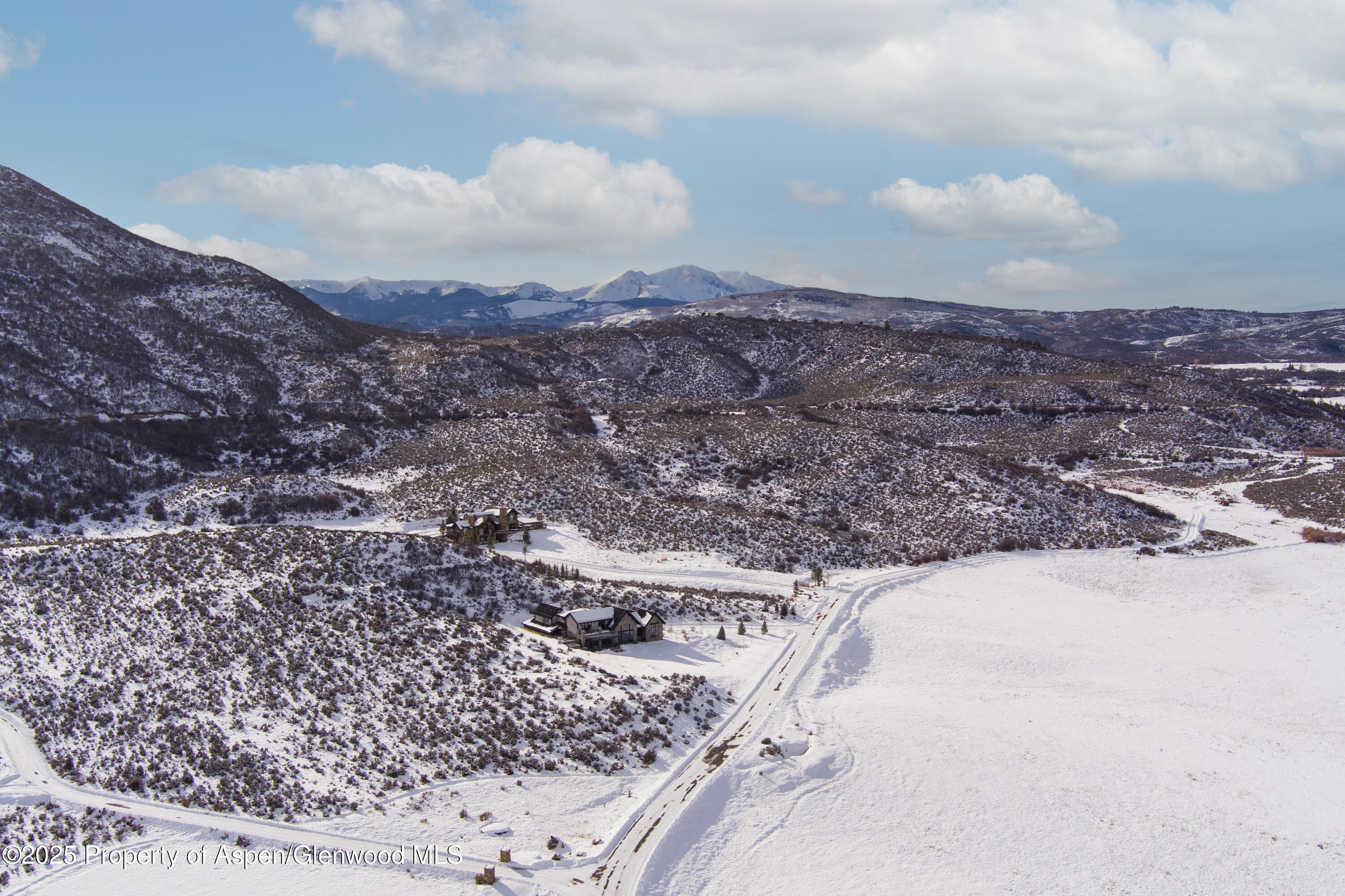 2388 Lazy O Road Snowmass, CO 81654 - Photo 65 of 65 a view of a dry yard with mountains in the background