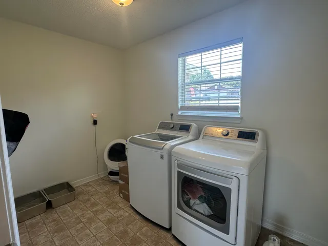 a utility room with dryer and washer