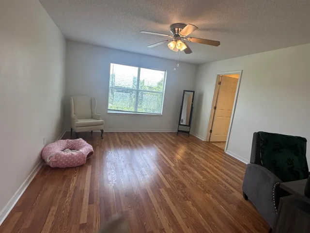 a view of livingroom with furniture and wooden floor