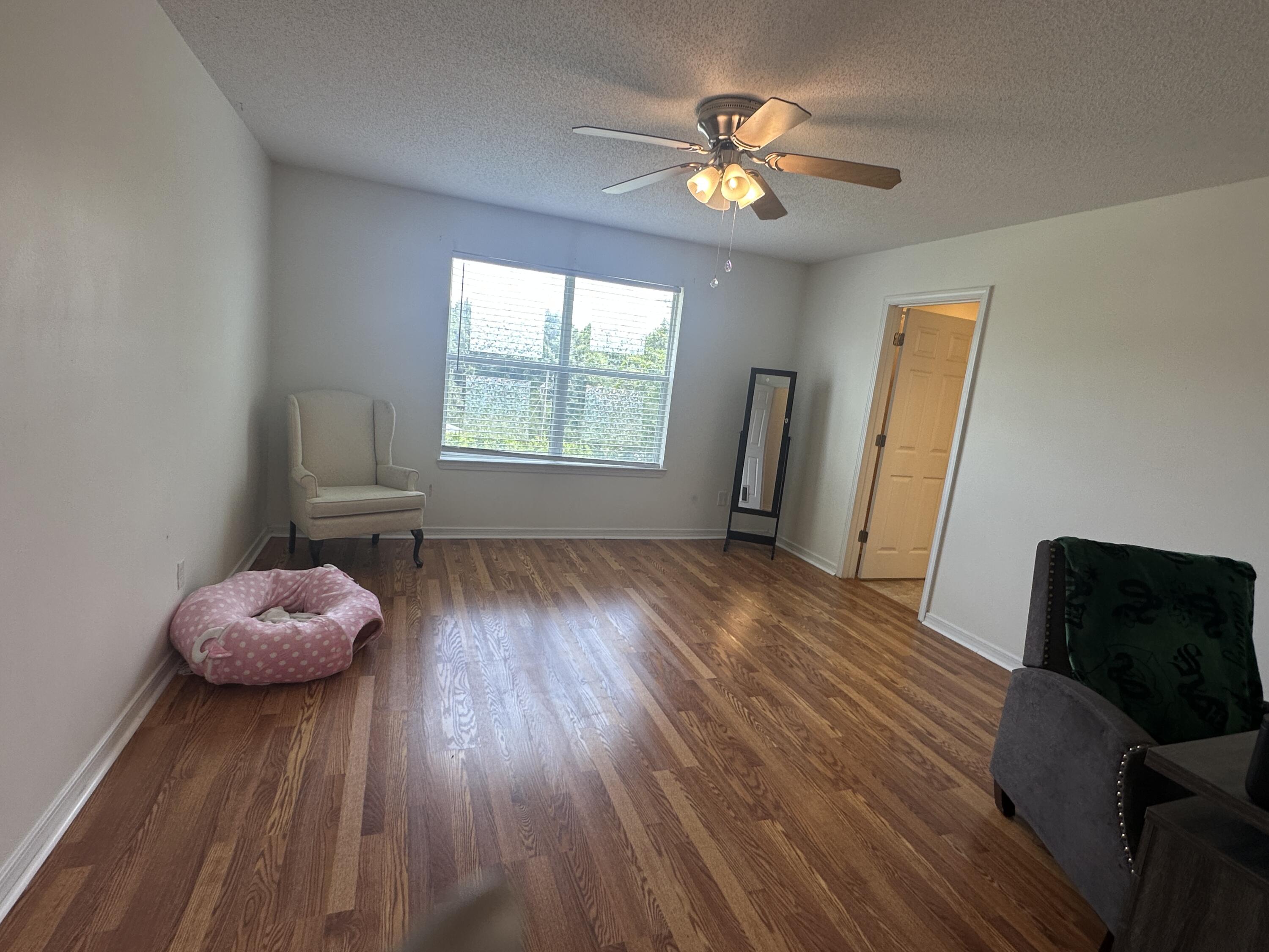 228 Trish Drive Crestview, FL 32536 - Photo 21 of 34 a view of livingroom with furniture and wooden floor