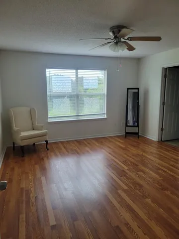 wooden floor and windows in a room