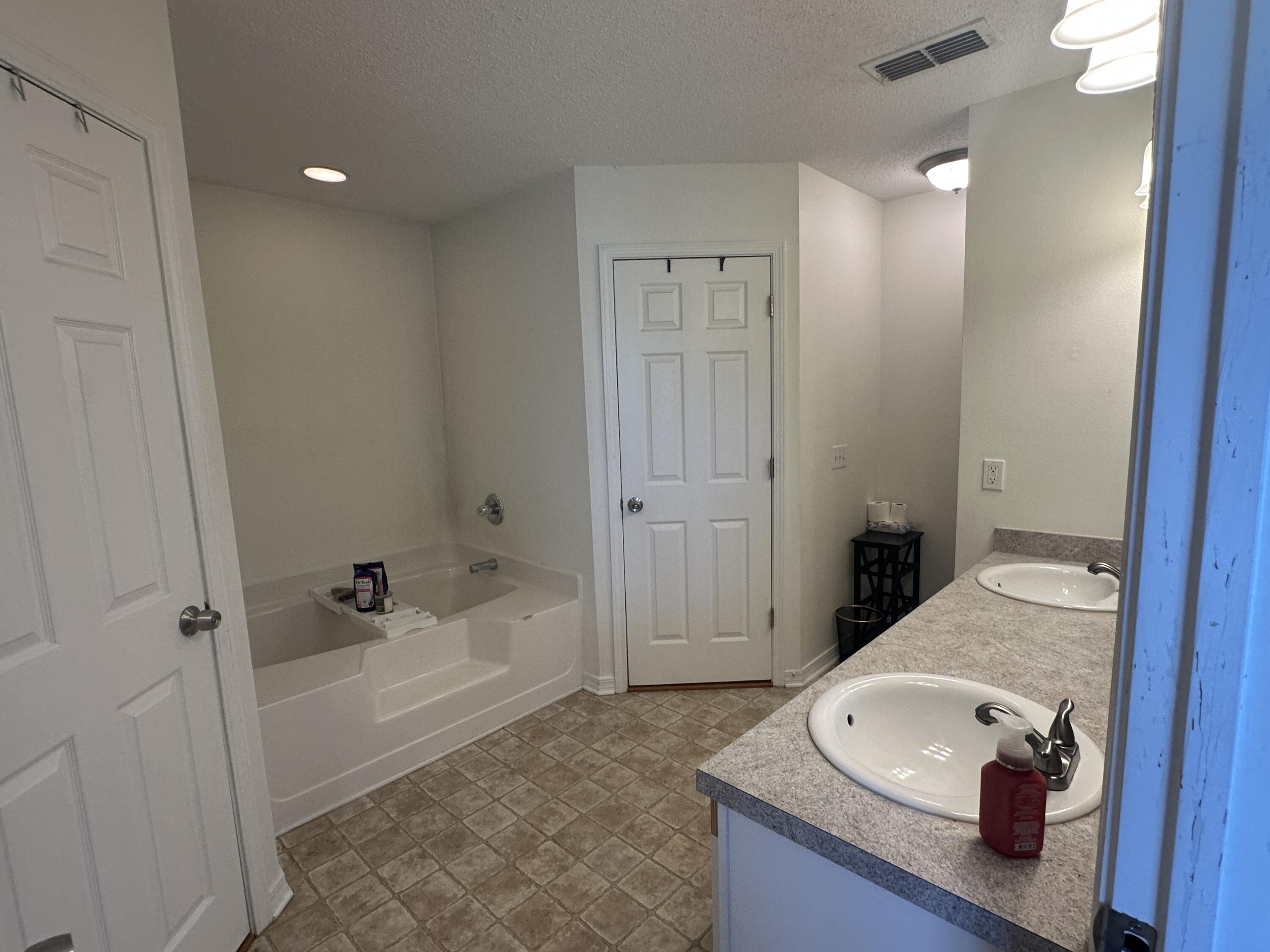 228 Trish Drive Crestview, FL 32536 - Photo 24 of 34 a bathroom with a tub and shower