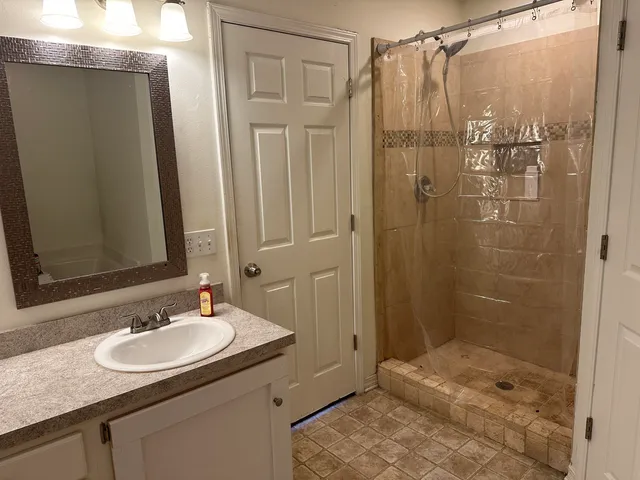 a bathroom with a sink and a mirror