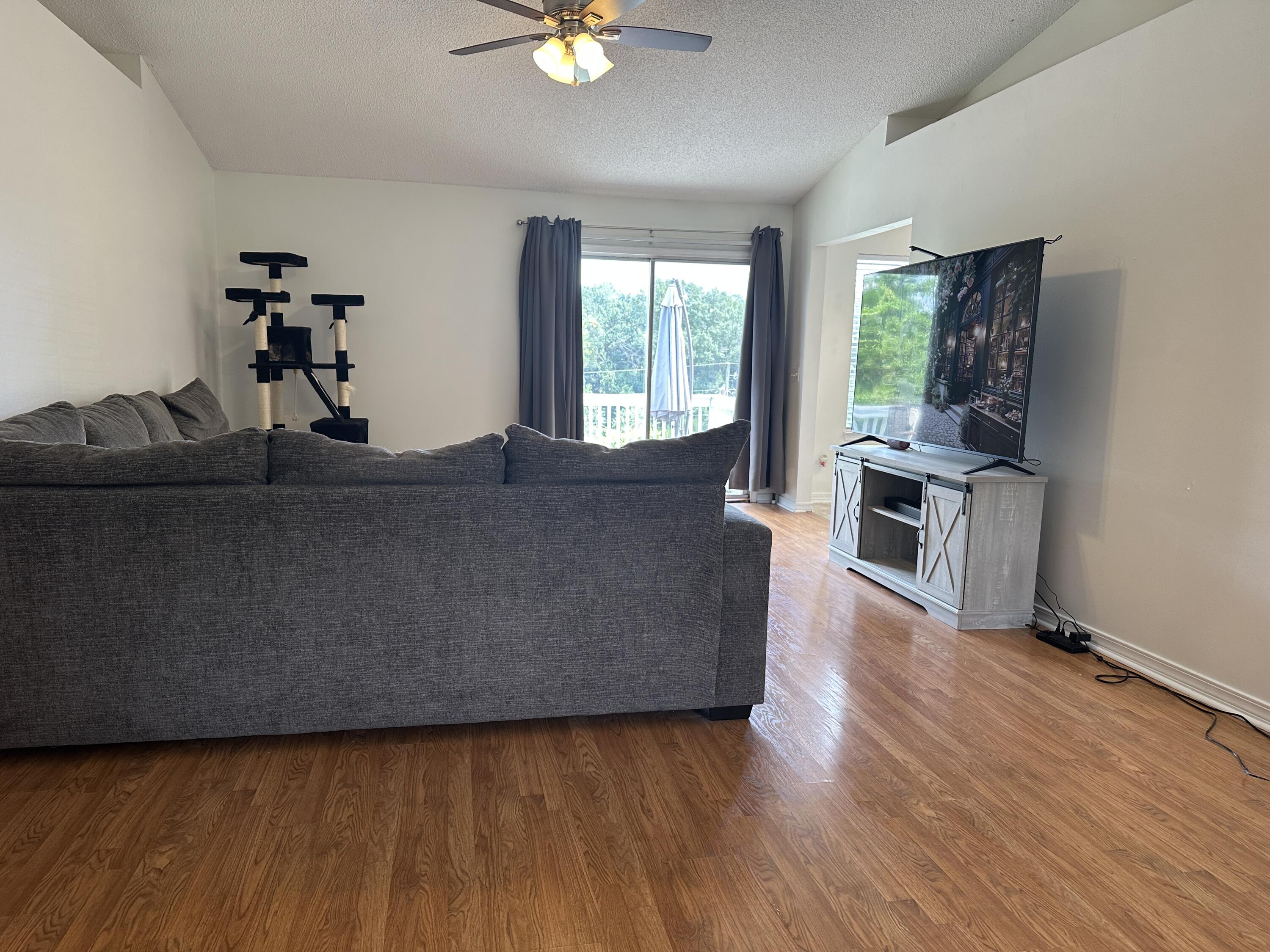 228 Trish Drive Crestview, FL 32536 - Photo 3 of 34 a living room with furniture and a flat screen tv
