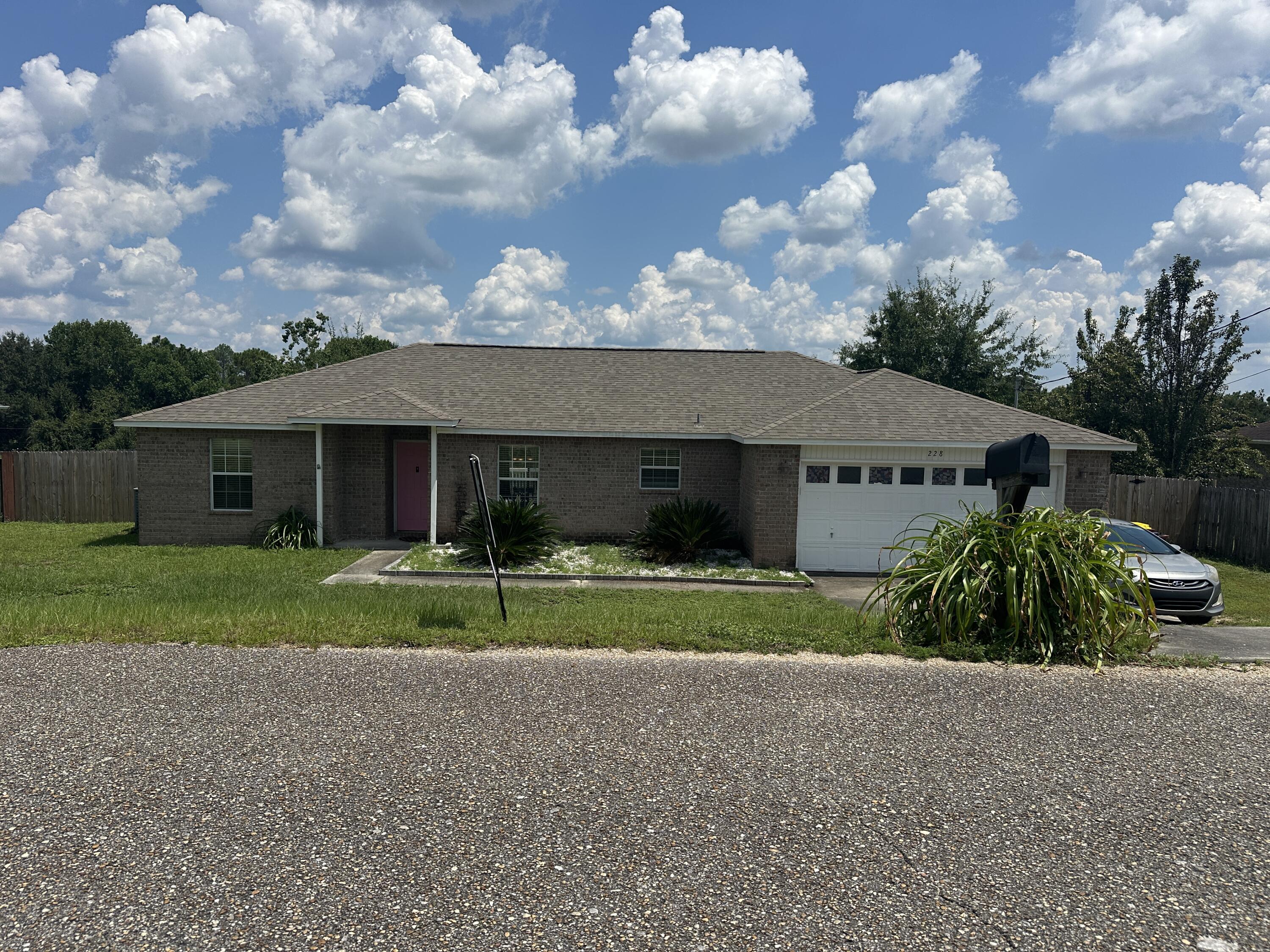 228 Trish Drive Crestview, FL 32536 - Photo 31 of 34 a front view of house with yard and green space