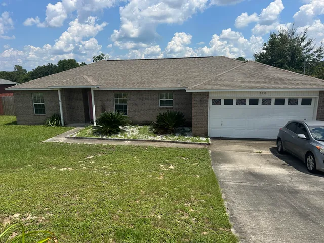 a house view with a garden space