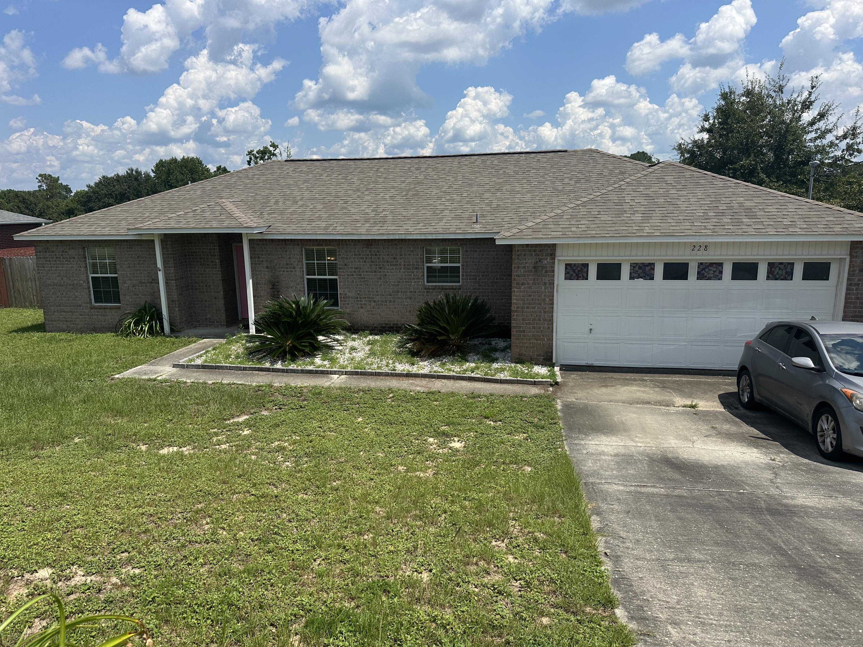 228 Trish Drive Crestview, FL 32536 - Photo 32 of 34 a house view with a garden space