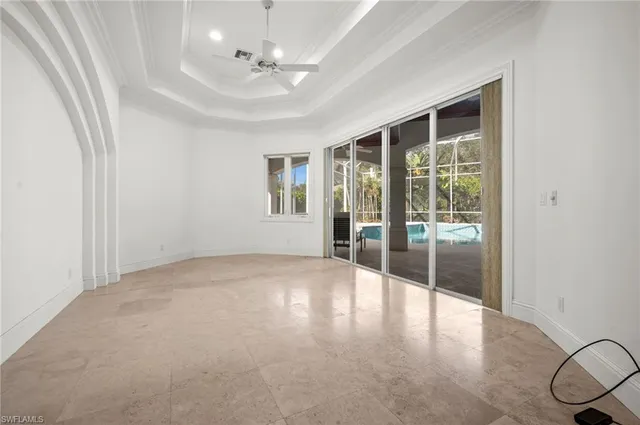 an empty room with windows and outdoor view