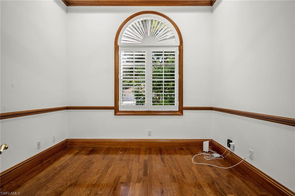 6898 Mill Run Road Naples, FL 34109 - Photo 15 of 38 a front view of a house with a rug