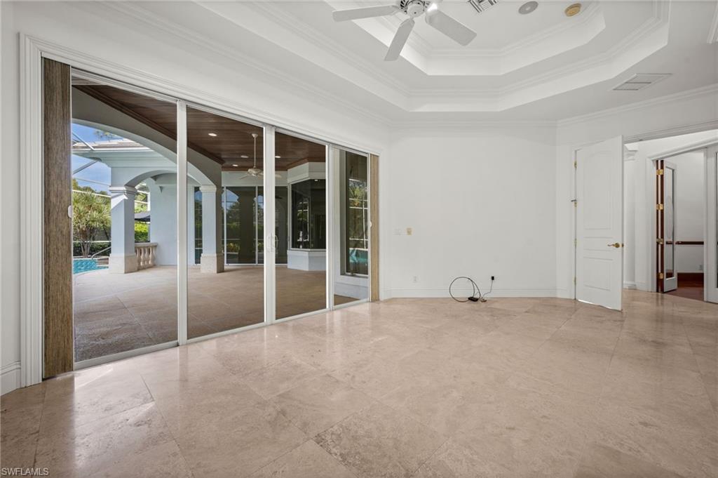6898 Mill Run Road Naples, FL 34109 - Photo 18 of 38 a view of an empty room with a window