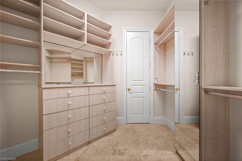 6898 Mill Run Road Naples, FL 34109 - Photo 26 of 38 a view of cabinets and utility room