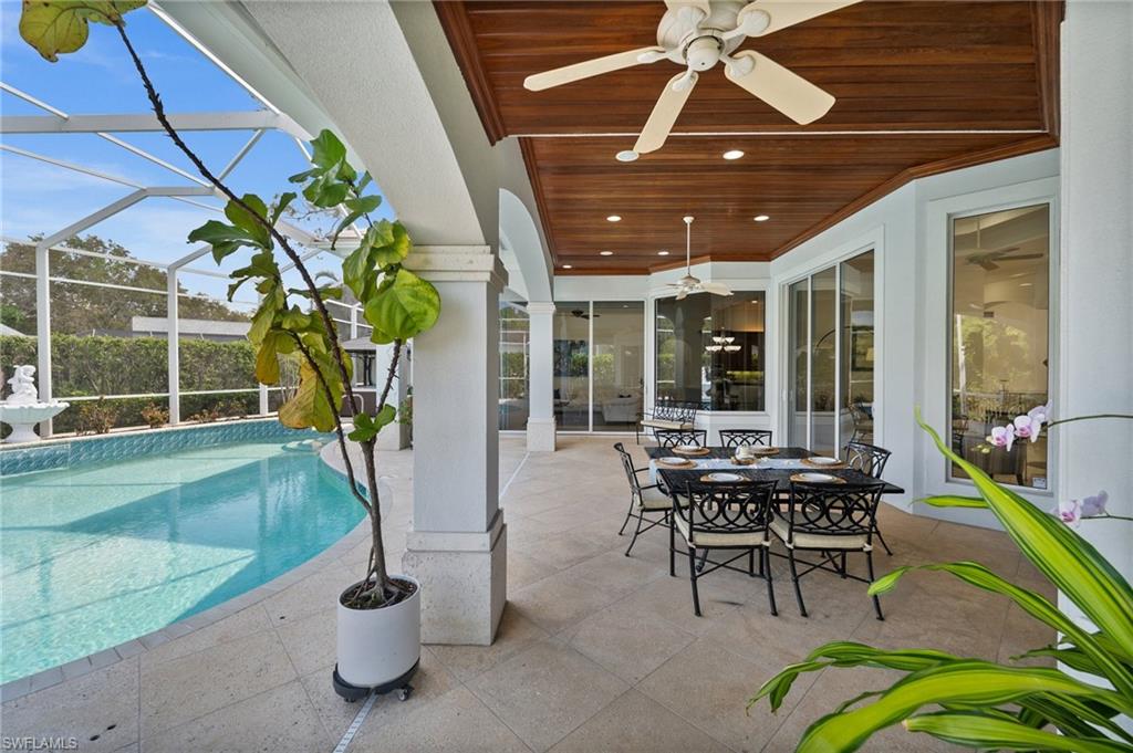 6898 Mill Run Road Naples, FL 34109 - Photo 29 of 38 a building outdoor space with patio furniture and potted plants