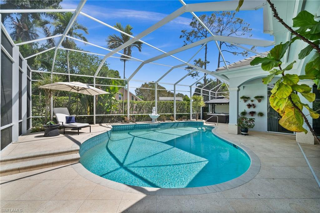 6898 Mill Run Road Naples, FL 34109 - Photo 31 of 38 a view of a swimming pool with a patio