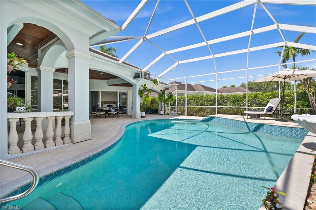 6898 Mill Run Road Naples, FL 34109 - Photo 36 of 38 a view of a swimming pool with a patio
