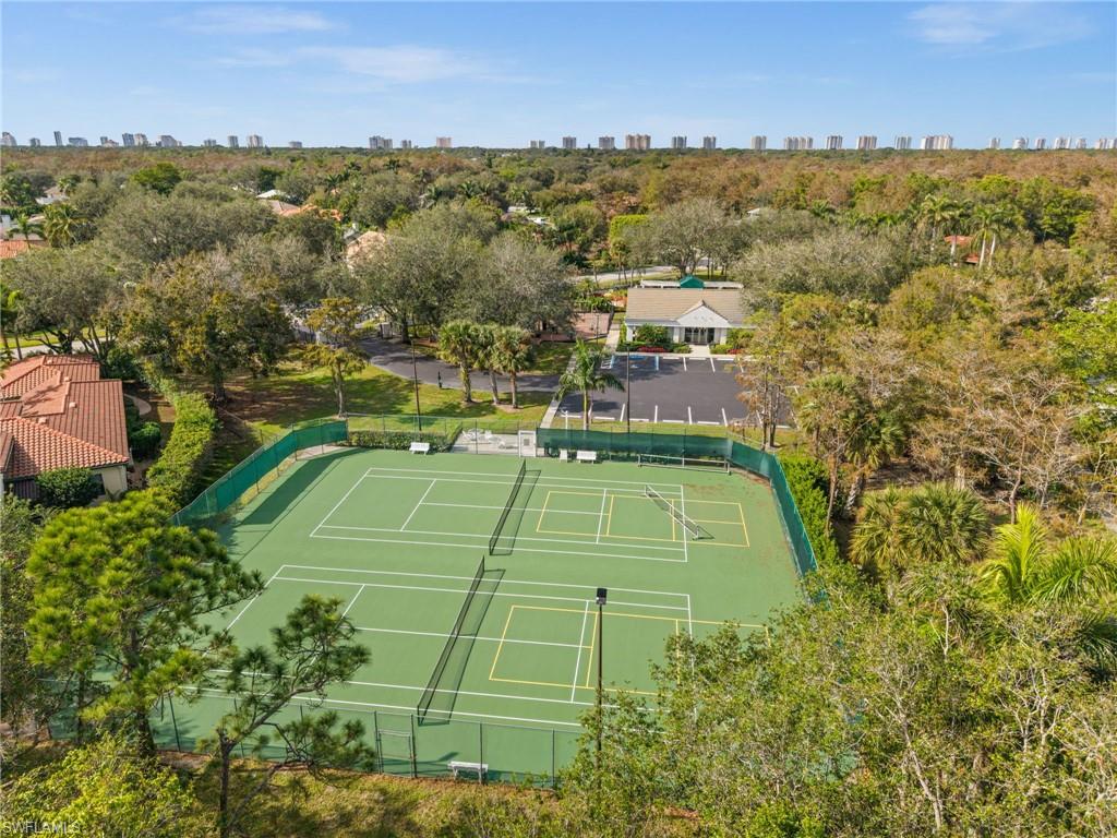 6898 Mill Run Road Naples, FL 34109 - Photo 38 of 38 an aerial view of a tennis ground and a houses