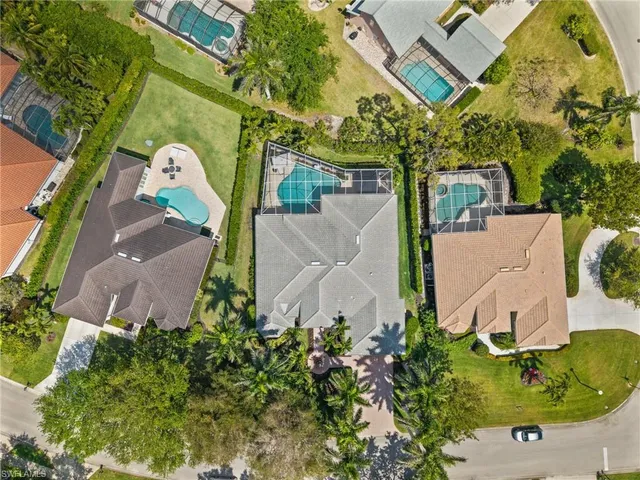 an aerial view of a house with a yard and garden