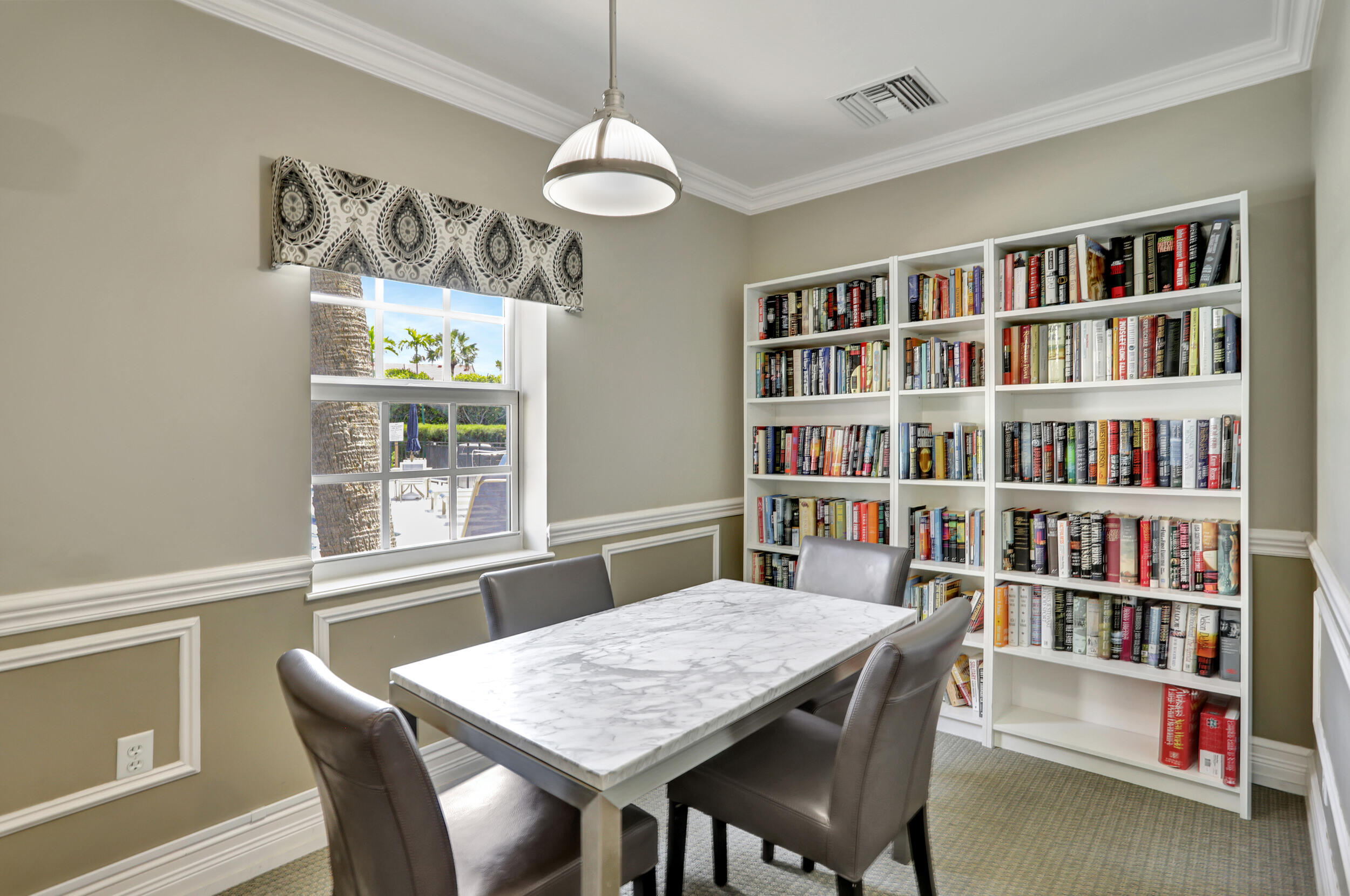 2871 North Ocean Boulevard, Unit C205 Boca Raton, FL 33431 - Photo 79 of 97 a view of a dining room with furniture window and wooden floor