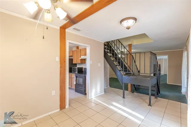 a kitchen with stainless steel appliances granite countertop a stove and a refrigerator