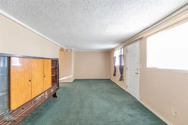 a view of a livingroom with storage & utility room