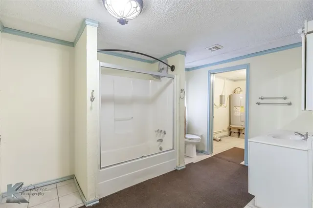 a bathroom with a sink a mirror and shower