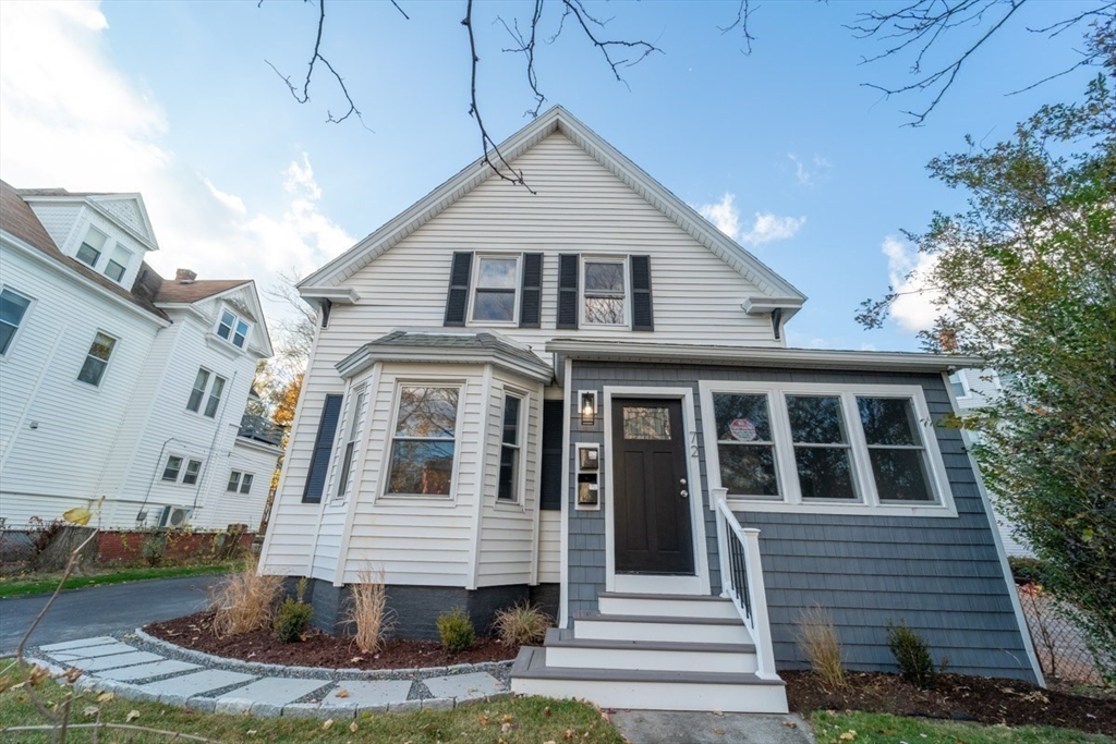 72 Florence Street, Unit 2 Worcester, MA 01603 - Photo 1 of 1 a front view of a house with a yard