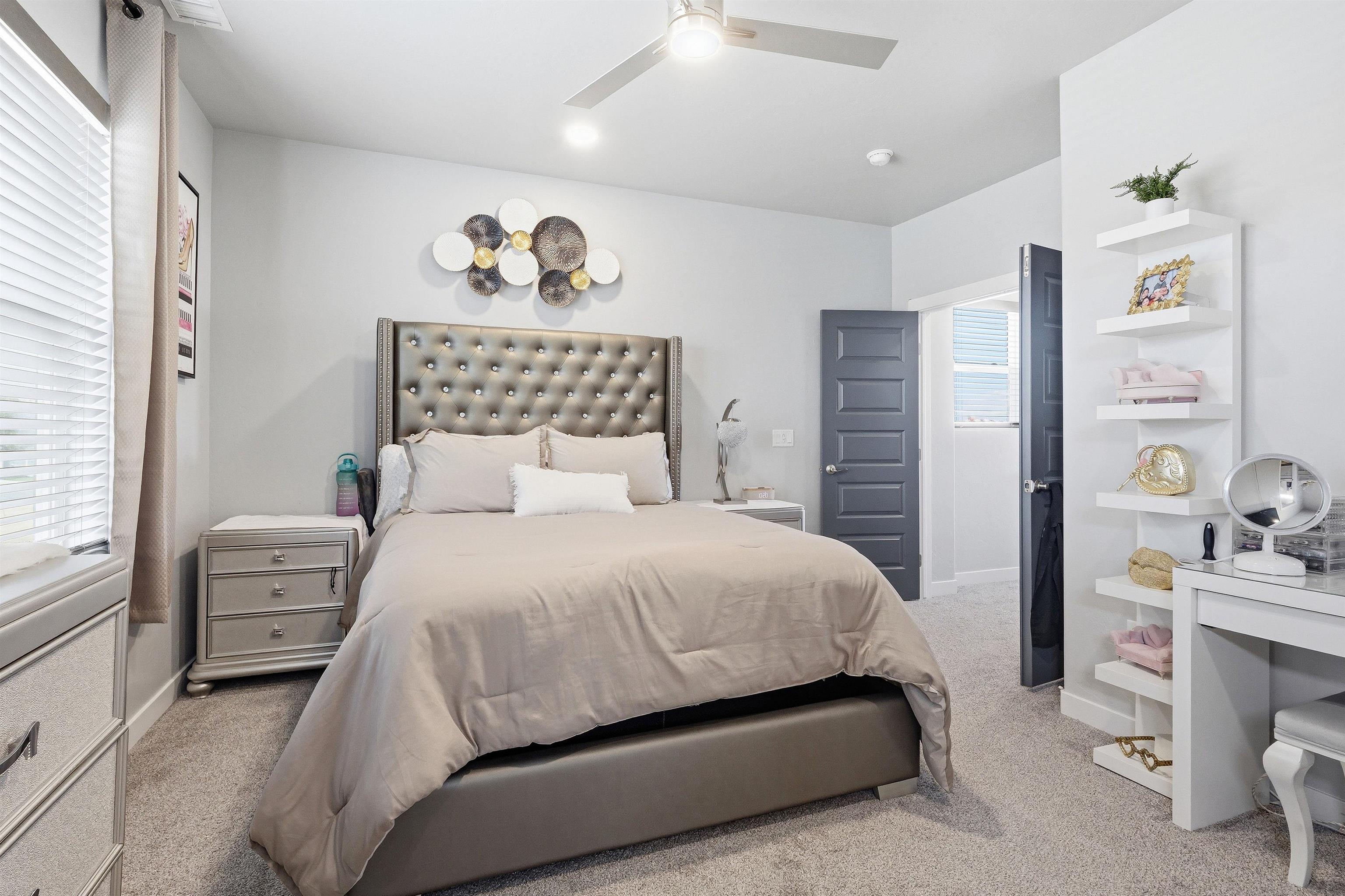 2459 Hamilton Road, Unit A Grand Junction, CO 81505 - Photo 13 of 27 a bedroom with a bed and a window