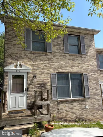a front view of a house with stairs