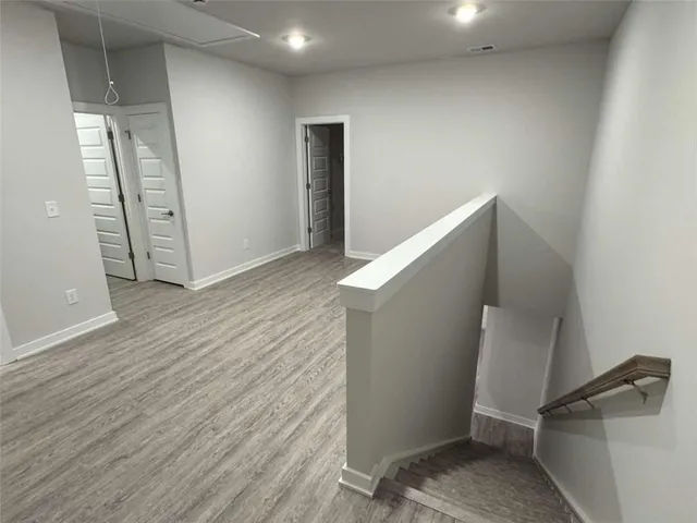 a view of entryway with stairs and wooden floor