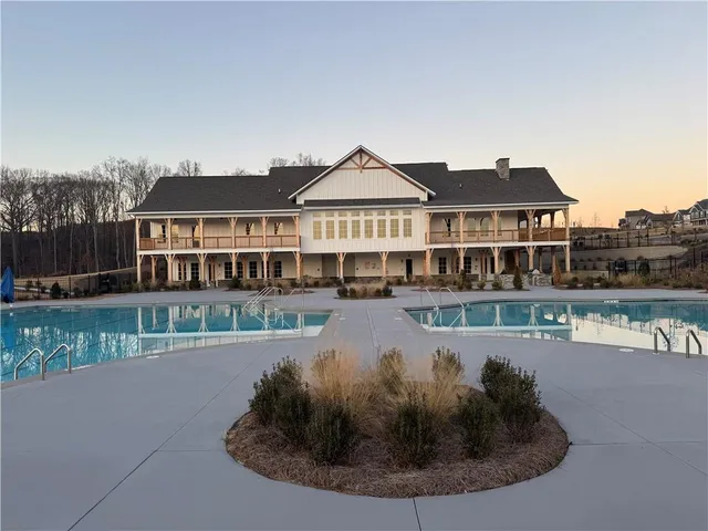 a view of a house with a swimming pool