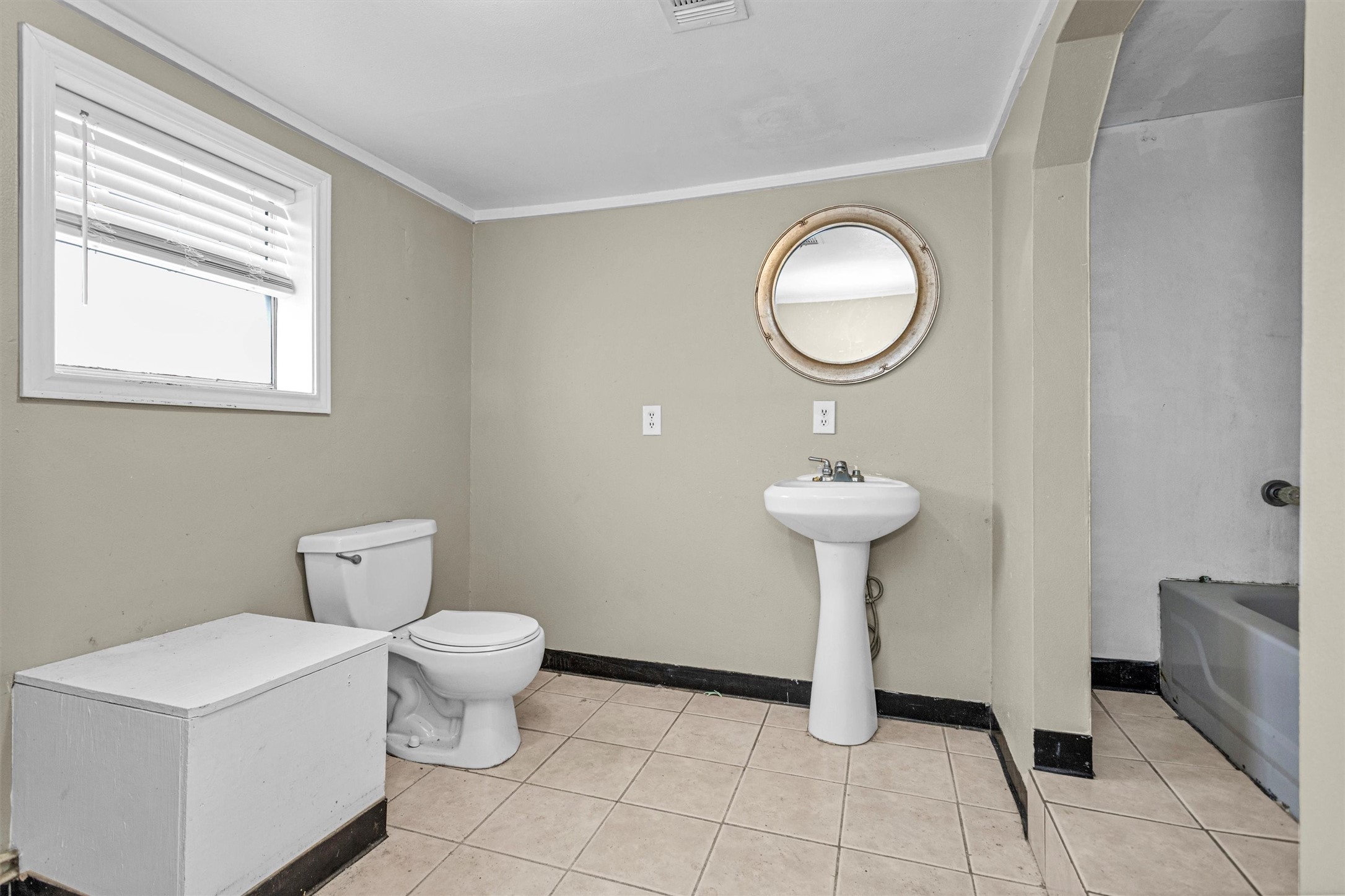 11031 Highway 150 Shepherd, TX 77371 - Photo 12 of 32 a bathroom with a toilet sink and a mirror