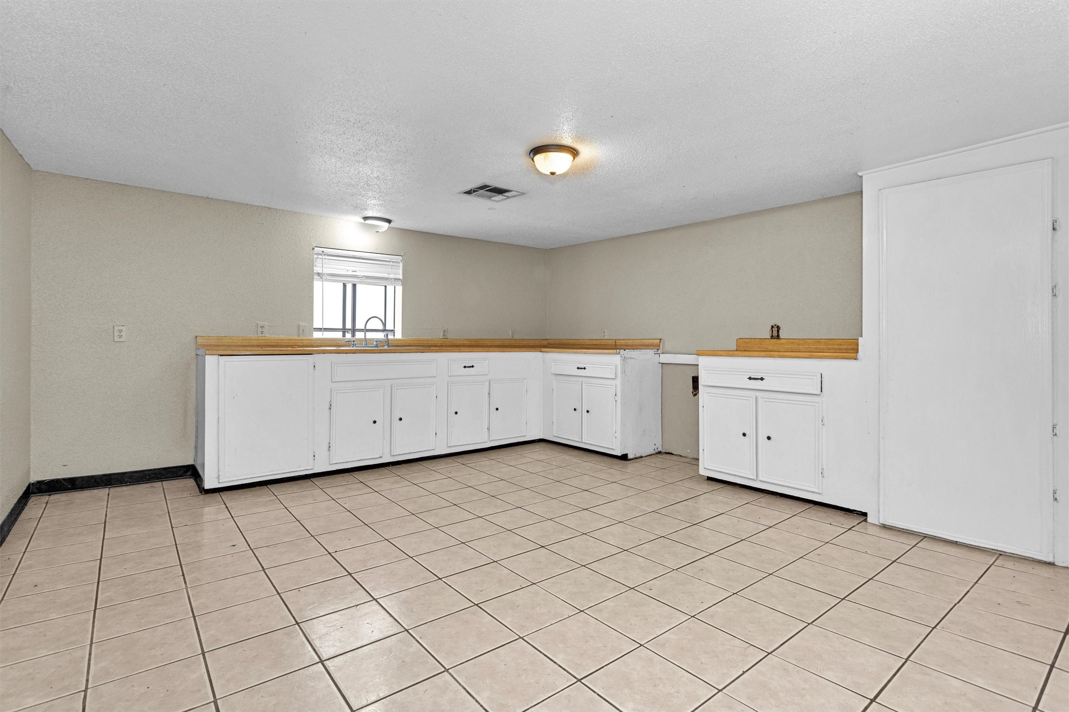 11031 Highway 150 Shepherd, TX 77371 - Photo 18 of 32 a view of a kitchen with white cabinets