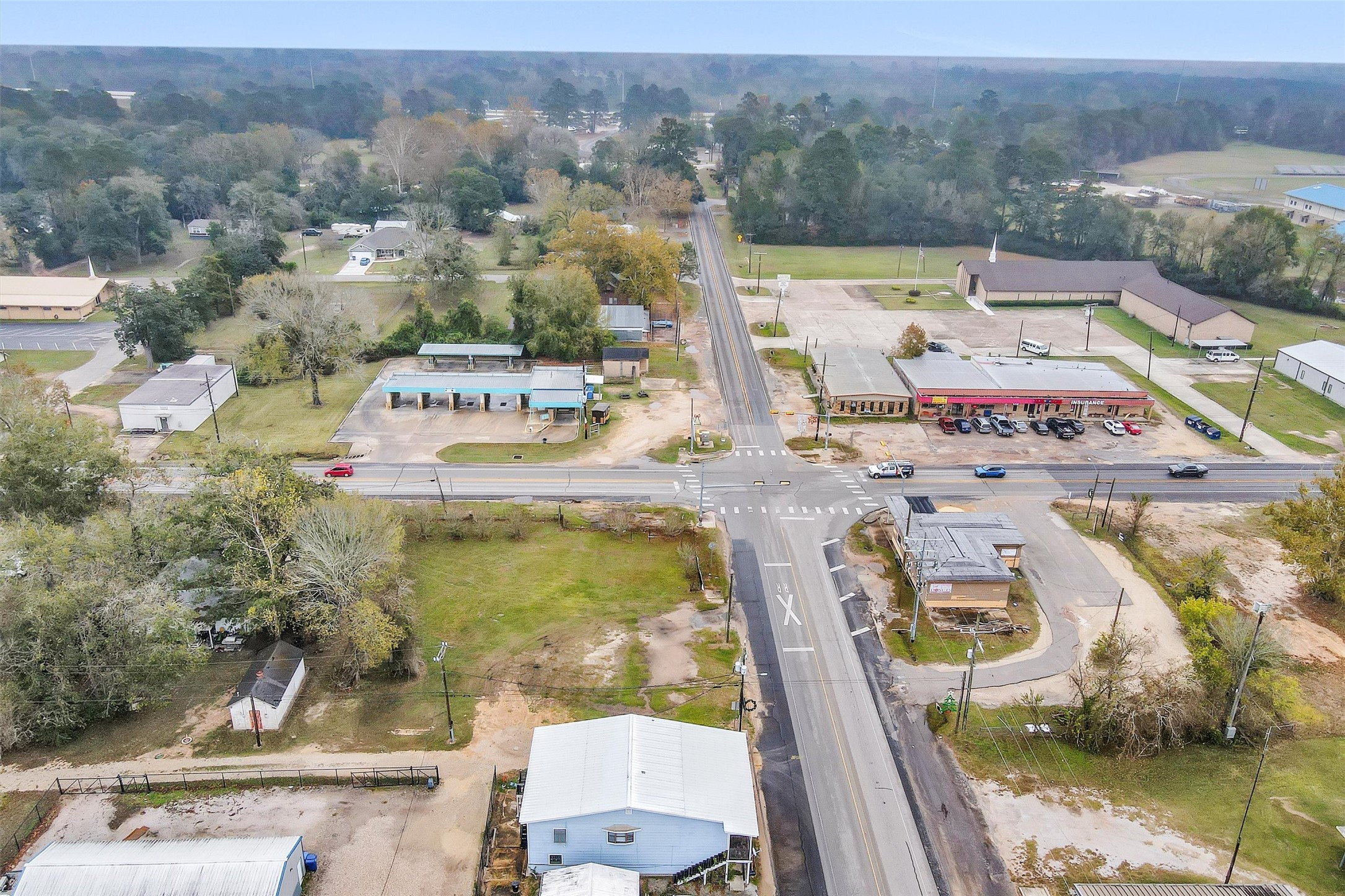11031 Highway 150 Shepherd, TX 77371 - Photo 28 of 32 an aerial view of residential houses with outdoor space