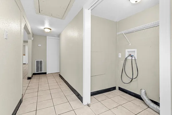 a view of a room with white walls