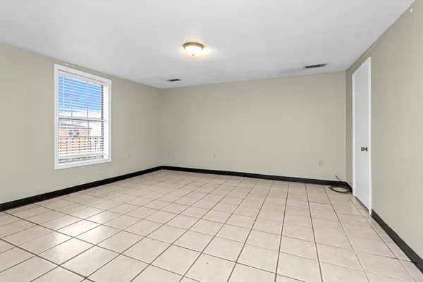 a view of an empty room and window