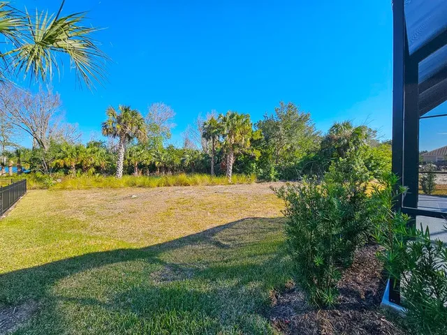 an aerial view of a house with a lake view