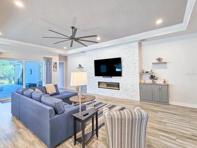 a dining room with stainless steel appliances kitchen island granite countertop furniture and a kitchen view