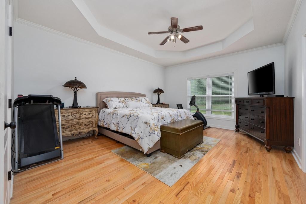 211 Oak Hollow Road Manchester, TN 37355 - Photo 13 of 31 a bedroom with furniture and flat screen tv