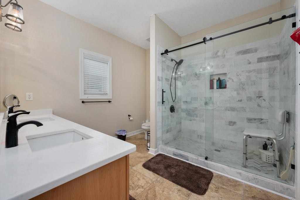 211 Oak Hollow Road Manchester, TN 37355 - Photo 14 of 31 a bathroom with a shower sink and mirror