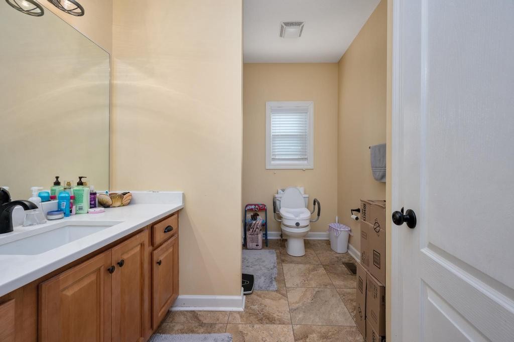 211 Oak Hollow Road Manchester, TN 37355 - Photo 18 of 31 a bathroom with a sink toilet and a mirror