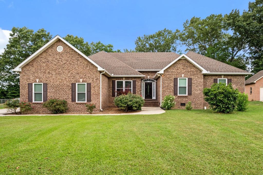 211 Oak Hollow Road Manchester, TN 37355 - Photo 31 of 31 a front view of a house with a yard and garage