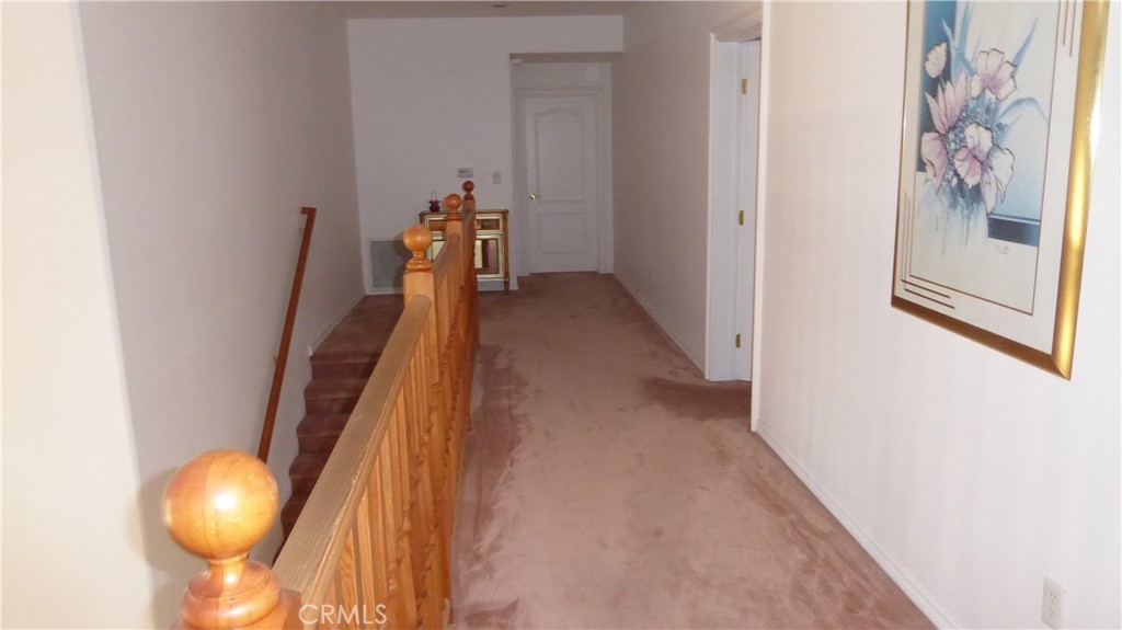 40482 Gavilan Mountain Road Fallbrook, CA 92028 - Photo 20 of 24 Stairs to hallway adjoining 3 bedrooms and 2 full baths upstairs